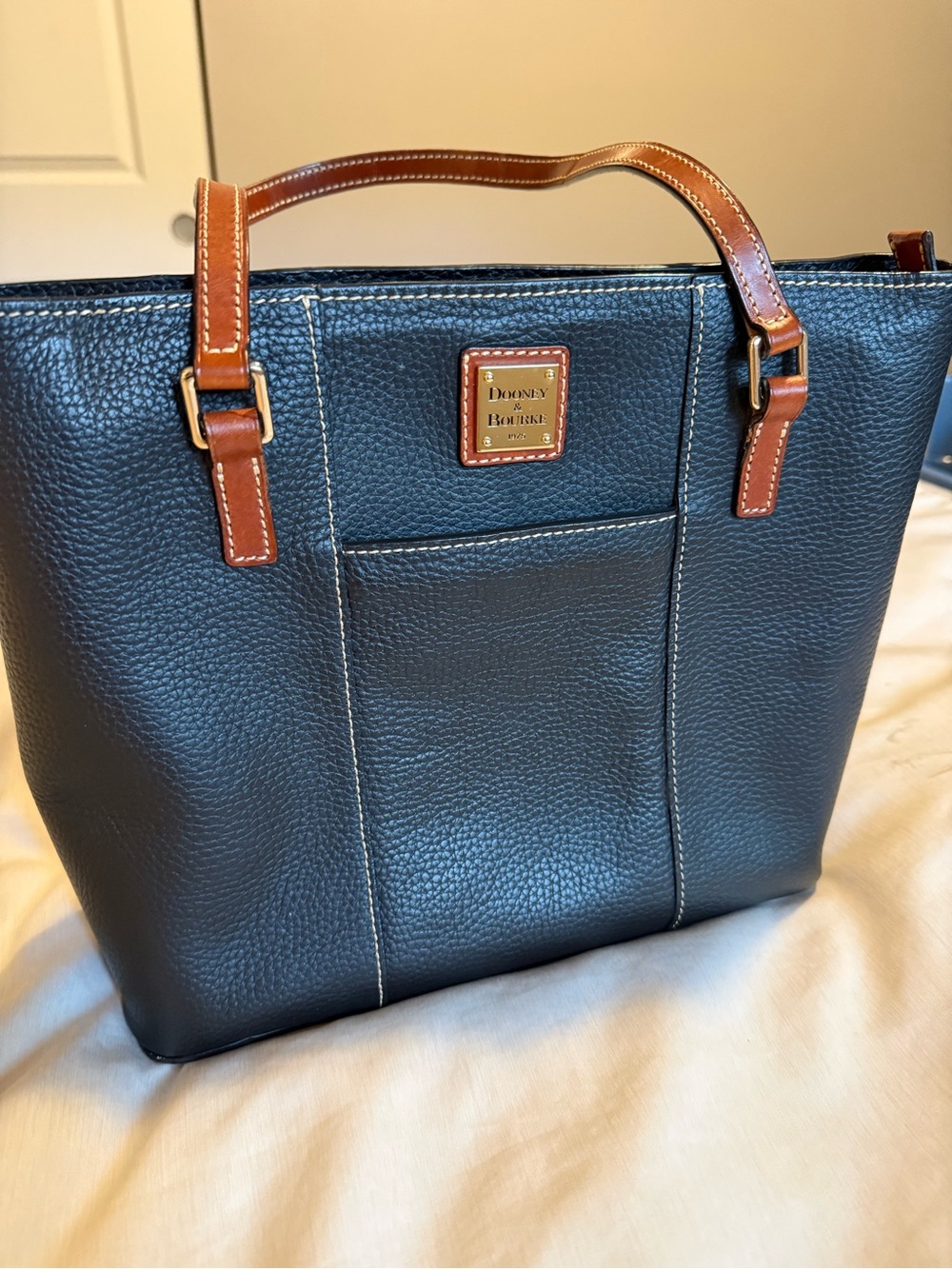 Dooney & Bourke Black Pebbled Leather Tote with Brown Trim and Handles